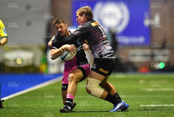 241123 - Cardiff Rugby v DHL Stormers - United Rugby Championship - Harri Millard of Cardiff is tackled by Jean-Luc du Plessis of Stormers