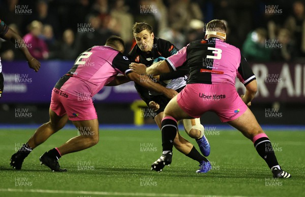 241123 - Cardiff Rugby v DHL Stormers - United Rugby Championship - Jean-Luc du Plessis of Stormers is tackled by Liam Belcher and Will Davies-King of Cardiff 