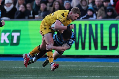 261225 - Cardiff Rugby v Dragons RFC, United Rugby Championship - Angus O’Brien of Dragons RFC takes on Josh Adams of Cardiff Rugby