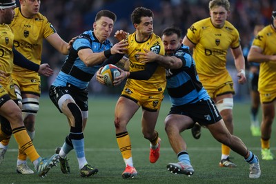 261225 - Cardiff Rugby v Dragons RFC, United Rugby Championship - Che Hope of Dragons RFC takes on Liam Belcher of Cardiff Rugby and Josh Adams of Cardiff Rugby