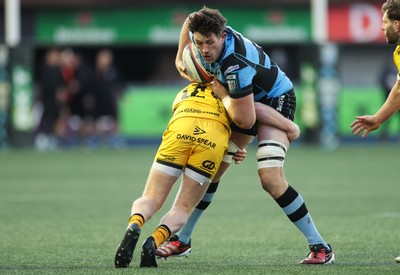 261225 - Cardiff Rugby v Dragons RFC, United Rugby Championship - Rory Thornton of Cardiff Rugby is tackled
