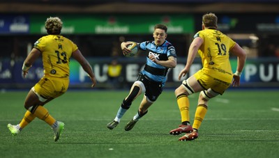 261225 - Cardiff Rugby v Dragons RFC, United Rugby Championship - Josh Adams of Cardiff Rugby takes on Matthew Screech of Dragons RFC’