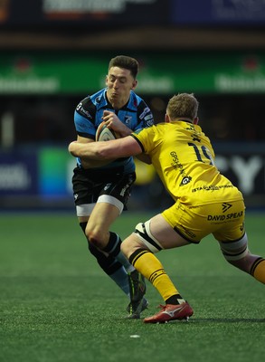 261225 - Cardiff Rugby v Dragons RFC, United Rugby Championship - Josh Adams of Cardiff Rugby takes on Matthew Screech of Dragons RFC’