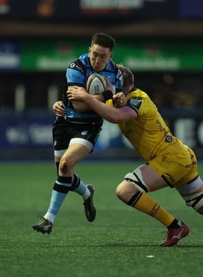 261225 - Cardiff Rugby v Dragons RFC, United Rugby Championship - Josh Adams of Cardiff Rugby takes on Matthew Screech of Dragons RFC’