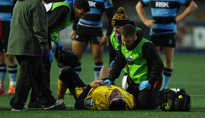 261225 - Cardiff Rugby v Dragons RFC, United Rugby Championship - Robert Hunt of Dragons RFC is treated for an injury before being stretchered from the pitch