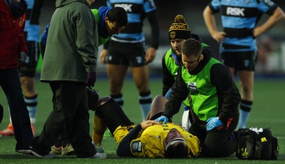 261225 - Cardiff Rugby v Dragons RFC, United Rugby Championship - Robert Hunt of Dragons RFC is treated for an injury before being stretchered from the pitch