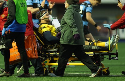 261225 - Cardiff Rugby v Dragons RFC, United Rugby Championship - Robert Hunt of Dragons RFC is treated for an injury before being stretchered from the pitch