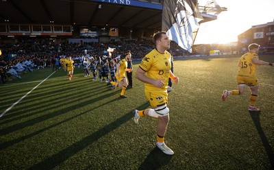 261225 - Cardiff Rugby v Dragons RFC, United Rugby Championship - Dragons players run out at the start of the match