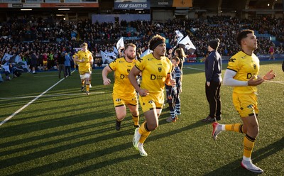 261225 - Cardiff Rugby v Dragons RFC, United Rugby Championship - Dragons players run out at the start of the match