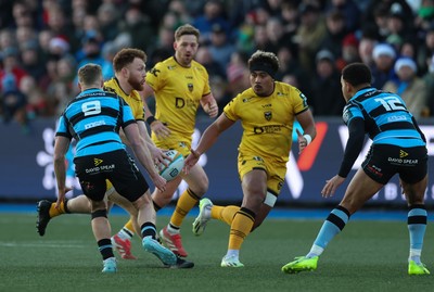 261225 - Cardiff Rugby v Dragons RFC, United Rugby Championship - Aneurin Owen of Dragons RFC offloads to Fine Inisi of Dragons RFC
