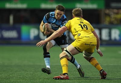 261225 - Cardiff Rugby v Dragons RFC, United Rugby Championship - Josh Adams of Cardiff Rugby takes on Matthew Screech of Dragons RFC