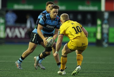 261225 - Cardiff Rugby v Dragons RFC, United Rugby Championship - Alex Mann of Cardiff Rugby takes on Tinus de Beer of Dragons RFC