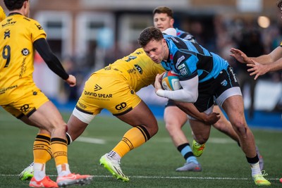 261225 - Cardiff Rugby v Dragons RFC - United Rugby Championship - Mason Grady of Cardiff Rugby is tackled by Fine Inisi of Dragons