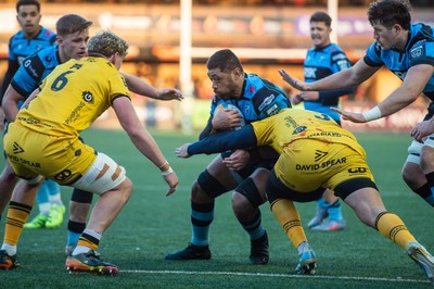 261225 - Cardiff Rugby v Dragons RFC - United Rugby Championship - Taulupe Faletau of Cardiff Rugby is tackled by Robert Hunt of Dragons