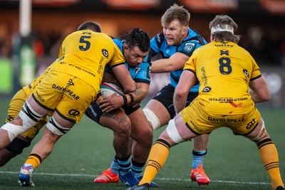 261225 - Cardiff Rugby v Dragons RFC - United Rugby Championship - Javan Sebastian of Cardiff Rugby is tackled by Ben Carter of Dragons