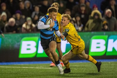 261225 - Cardiff Rugby v Dragons RFC - United Rugby Championship - Cam Winnett of Cardiff Rugby is tackled by David Richards of Dragons