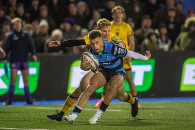 261225 - Cardiff Rugby v Dragons RFC - United Rugby Championship - Cam Winnett of Cardiff Rugby is tackled by David Richards of Dragons