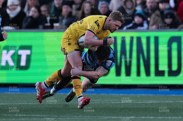261225 - Cardiff Rugby v Dragons RFC, United Rugby Championship - Angus O’Brien of Dragons RFC takes on Josh Adams of Cardiff Rugby