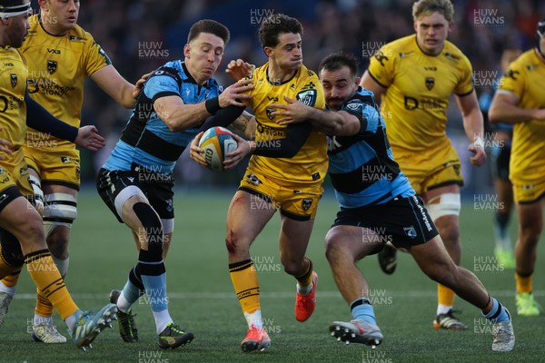 261225 - Cardiff Rugby v Dragons RFC, United Rugby Championship - Che Hope of Dragons RFC takes on Liam Belcher of Cardiff Rugby and Josh Adams of Cardiff Rugby