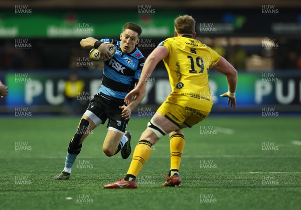 261225 - Cardiff Rugby v Dragons RFC, United Rugby Championship - Josh Adams of Cardiff Rugby takes on Matthew Screech of Dragons RFC’