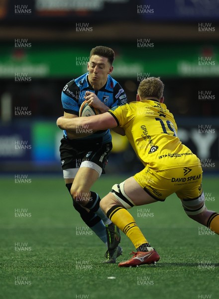 261225 - Cardiff Rugby v Dragons RFC, United Rugby Championship - Josh Adams of Cardiff Rugby takes on Matthew Screech of Dragons RFC’