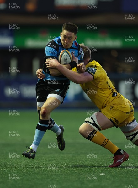 261225 - Cardiff Rugby v Dragons RFC, United Rugby Championship - Josh Adams of Cardiff Rugby takes on Matthew Screech of Dragons RFC’