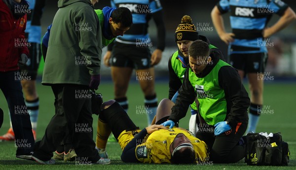261225 - Cardiff Rugby v Dragons RFC, United Rugby Championship - Robert Hunt of Dragons RFC is treated for an injury before being stretchered from the pitch