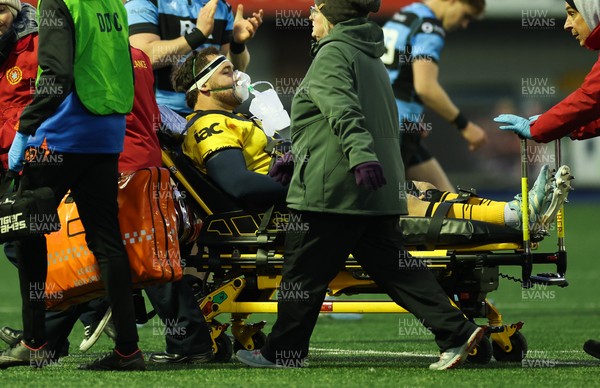 261225 - Cardiff Rugby v Dragons RFC, United Rugby Championship - Robert Hunt of Dragons RFC is treated for an injury before being stretchered from the pitch