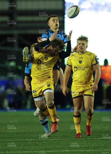 261225 - Cardiff Rugby v Dragons RFC, United Rugby Championship - Rhodri Williams of Dragons RFC and Cam Winnett of Cardiff Rugby compete for the ball