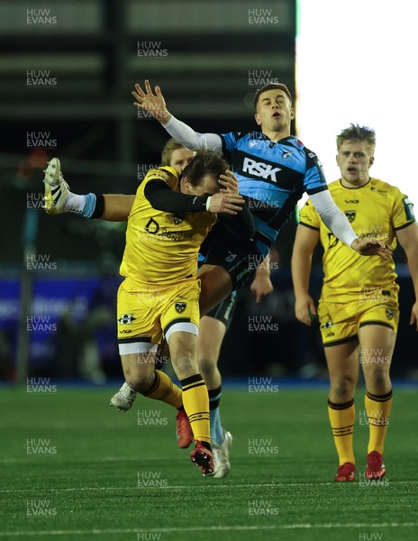 261225 - Cardiff Rugby v Dragons RFC, United Rugby Championship - Rhodri Williams of Dragons RFC and Cam Winnett of Cardiff Rugby compete for the ball