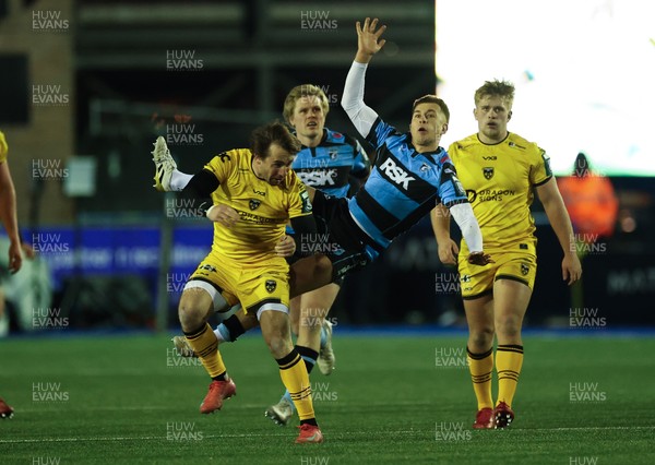 261225 - Cardiff Rugby v Dragons RFC, United Rugby Championship - Rhodri Williams of Dragons RFC and Cam Winnett of Cardiff Rugby compete for the ball