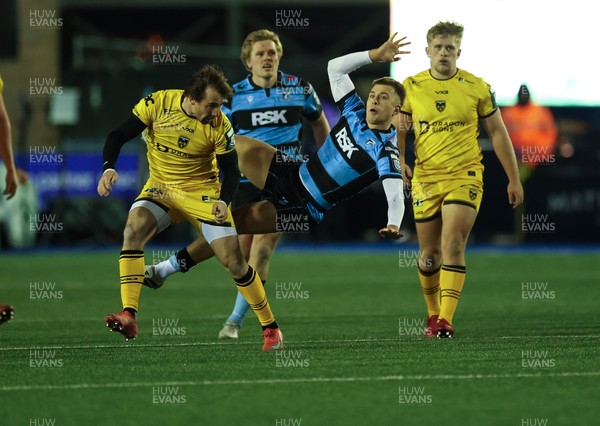261225 - Cardiff Rugby v Dragons RFC, United Rugby Championship - Rhodri Williams of Dragons RFC and Cam Winnett of Cardiff Rugby compete for the ball