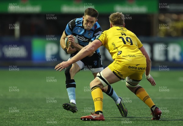 261225 - Cardiff Rugby v Dragons RFC, United Rugby Championship - Josh Adams of Cardiff Rugby takes on Matthew Screech of Dragons RFC