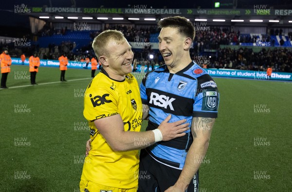 261225 - Cardiff Rugby v Dragons RFC, United Rugby Championship - Tinus de Beer of Dragons RFC and Josh Adams of Cardiff Rugby at the end of the match