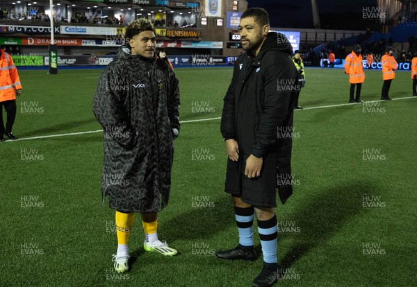 261225 - Cardiff Rugby v Dragons RFC, United Rugby Championship - Fine Inisi of Dragons RFC and Taulupe Faletau of Cardiff Rugby at the end of the match