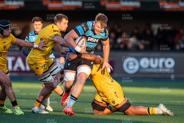 261225 - Cardiff Rugby v Dragons RFC - United Rugby Championship - Josh McNally of Cardiff Rugby is tackled by Levi Douglas of Dragons