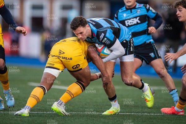 261225 - Cardiff Rugby v Dragons RFC - United Rugby Championship - Mason Grady of Cardiff Rugby is tackled by Fine Inisi of Dragons