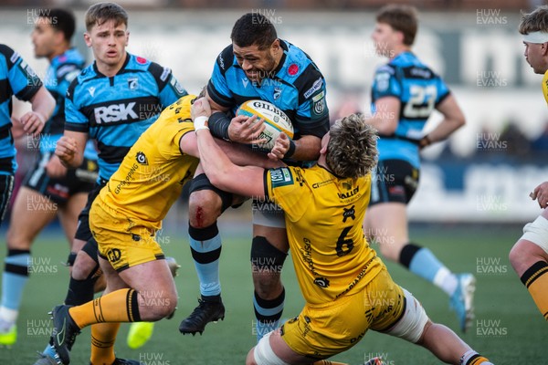 261225 - Cardiff Rugby v Dragons RFC - United Rugby Championship - Taulupe Faletau of Cardiff Rugby is tackled by Ryan Woodman of Dragons