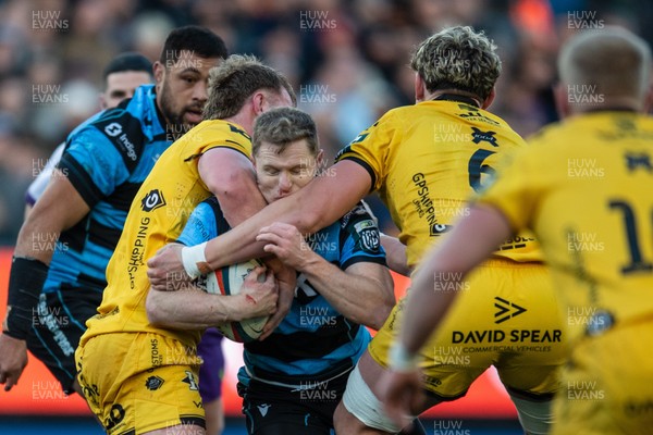261225 - Cardiff Rugby v Dragons RFC - United Rugby Championship - Aled Davies of Cardiff Rugby is tackled by George Roberts of Dragons and Ryan Woodman of Dragons