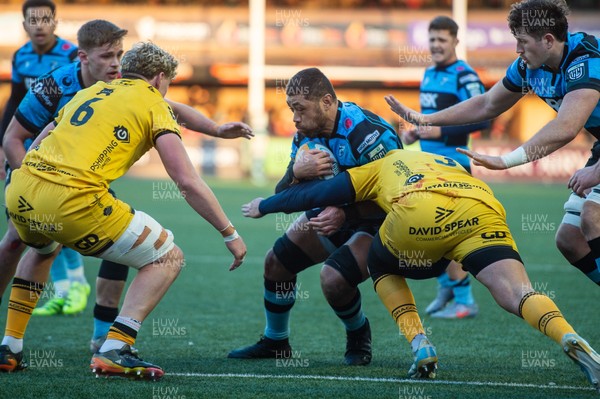 261225 - Cardiff Rugby v Dragons RFC - United Rugby Championship - Taulupe Faletau of Cardiff Rugby is tackled by Robert Hunt of Dragons