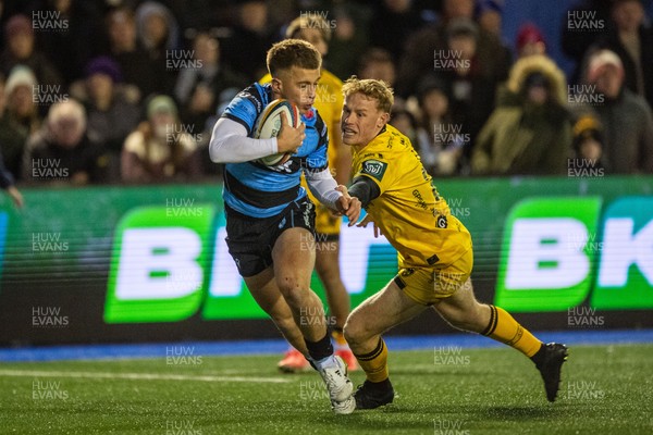 261225 - Cardiff Rugby v Dragons RFC - United Rugby Championship - Cam Winnett of Cardiff Rugby is tackled by David Richards of Dragons