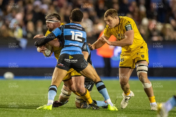 261225 - Cardiff Rugby v Dragons RFC - United Rugby Championship - Wyn Jones of Dragons is tackled by Ben Thomas of Cardiff Rugby