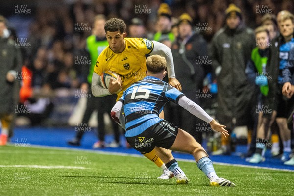 261225 - Cardiff Rugby v Dragons RFC - United Rugby Championship - Rio Dyer of Dragons takes on Cam Winnett of Cardiff Rugby