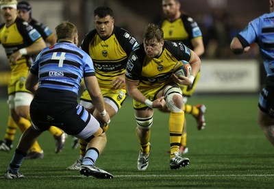 301124 - Cardiff Rugby v Dragons RFC - United Rugby Championship - Matthew Screech of Dragons is tackled by Josh McNally of Cardiff 