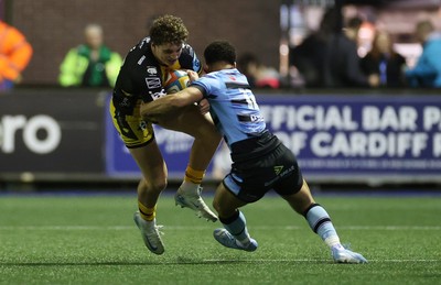 301124 - Cardiff Rugby v Dragons RFC - United Rugby Championship - Joe Westwood of Dragons is tackled by Ben Thomas of Cardiff 