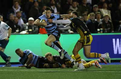 301124 - Cardiff Rugby v Dragons RFC - United Rugby Championship - Josh Adams of Cardiff is tackled by Harry Wilson of Dragons 