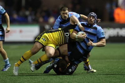 301124 - Cardiff Rugby v Dragons RFC - United Rugby Championship - Alun Lawrence of Cardiff is tackled by Ryan Woodman of Dragons 