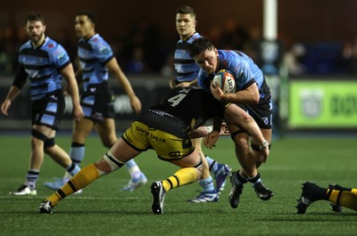 301124 - Cardiff Rugby v Dragons RFC - United Rugby Championship - Alex Mann of Cardiff is tackled by Matthew Screech of Dragons 