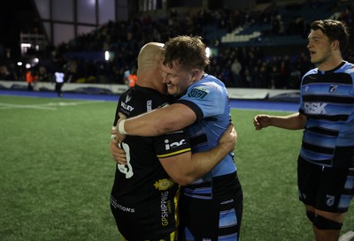 301124 - Cardiff Rugby v Dragons RFC - United Rugby Championship - Dmitri Arhip of Dragons and Evan Lloyd of Cardiff at full time