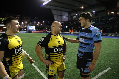 301124 - Cardiff Rugby v Dragons RFC - United Rugby Championship - Dmitri Arhip of Dragons and Teddy Williams of Cardiff at full time